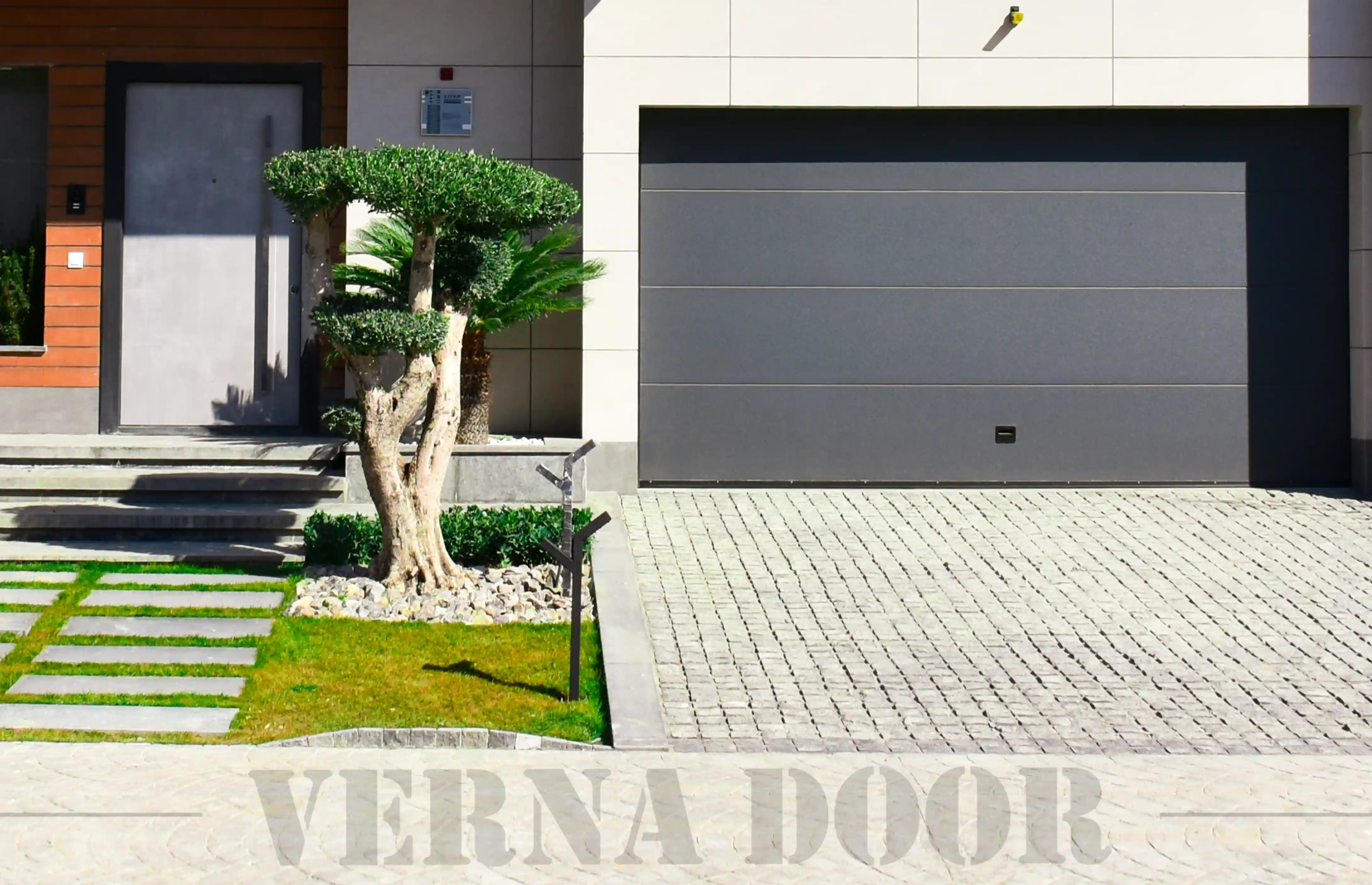 luxury sectional garage door vernadoor installed in modern residential building parking