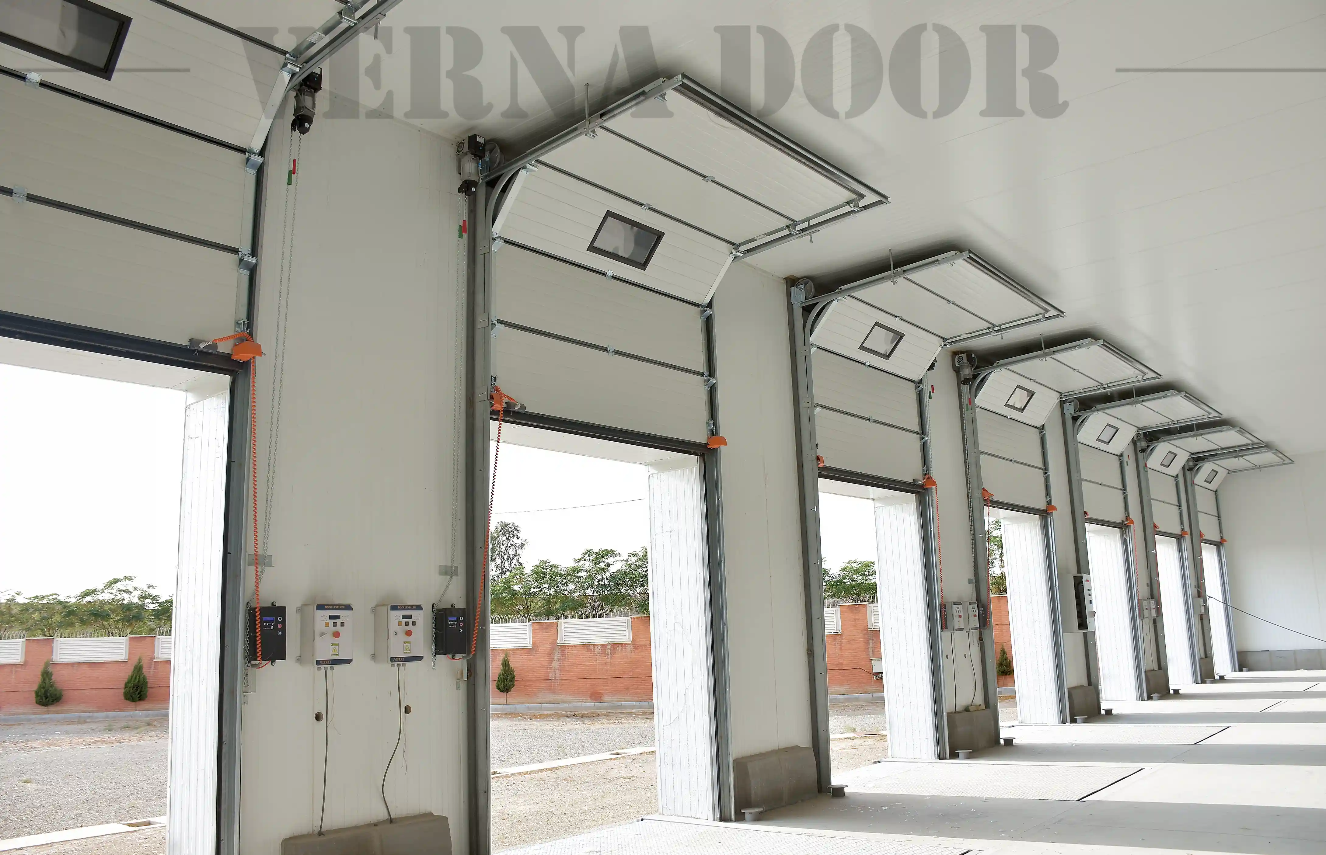 sectional industrial garage door vernadoor installed in warehouse for commercial storage