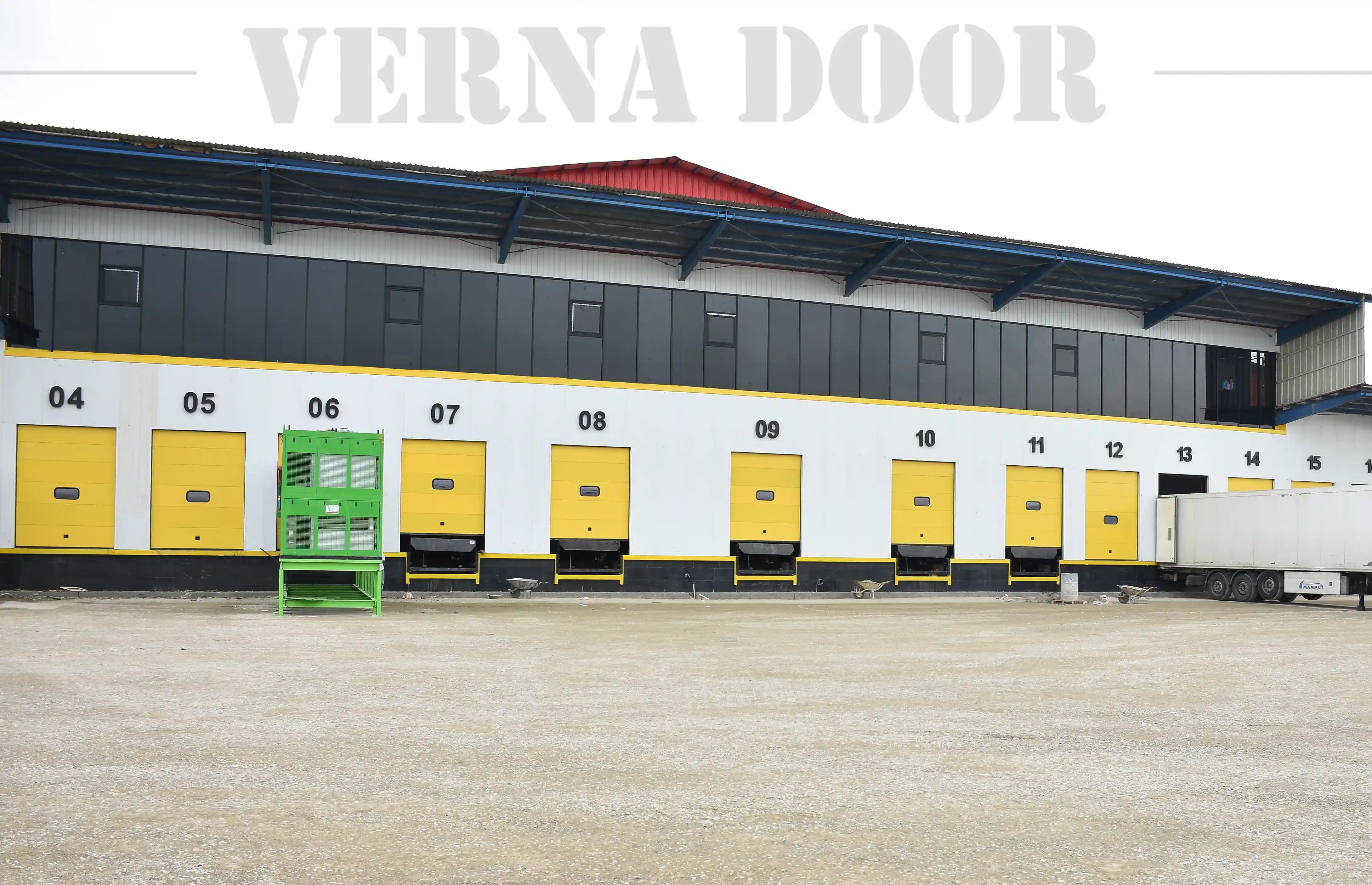sectional industrial garage door vernadoor installed in warehouse for business storage
